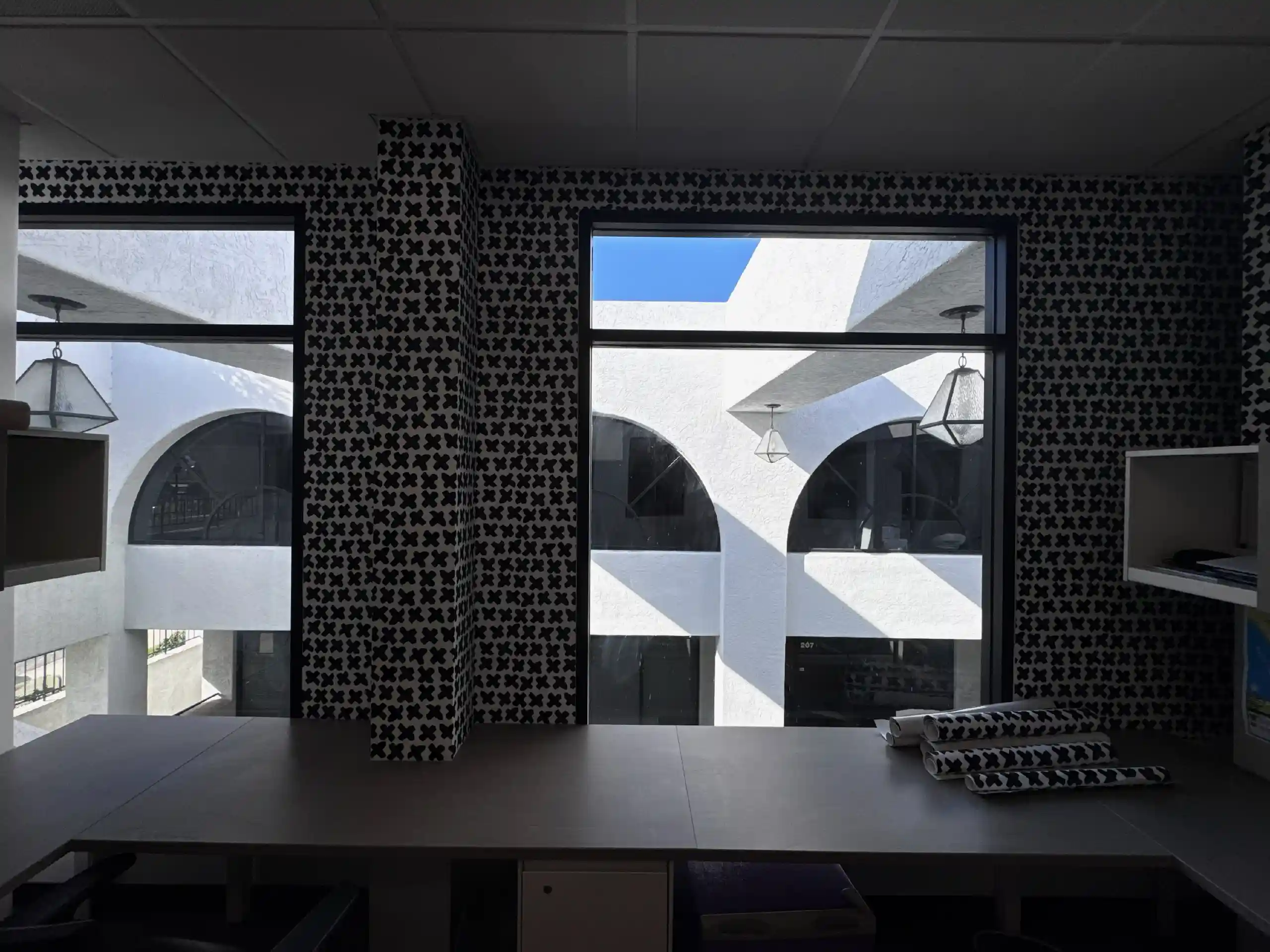 Geometric wallpaper on a dining-room wall